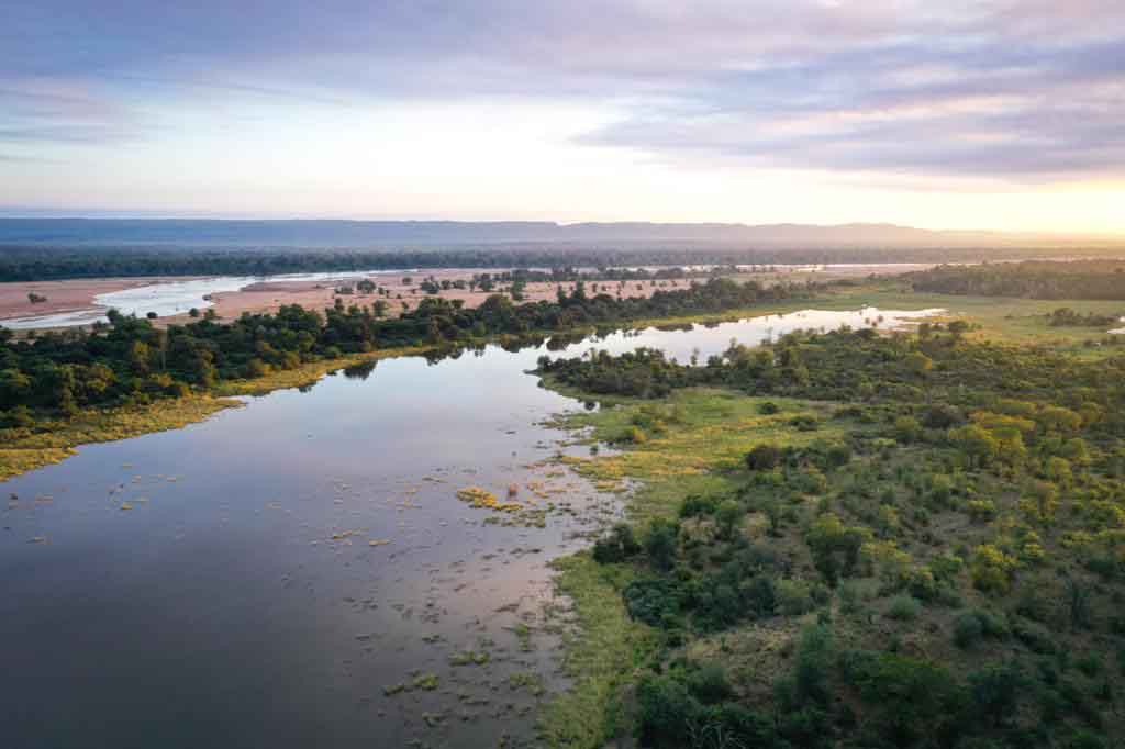 Landscape shot of Pan Limpop with bushland either side of a stream of water