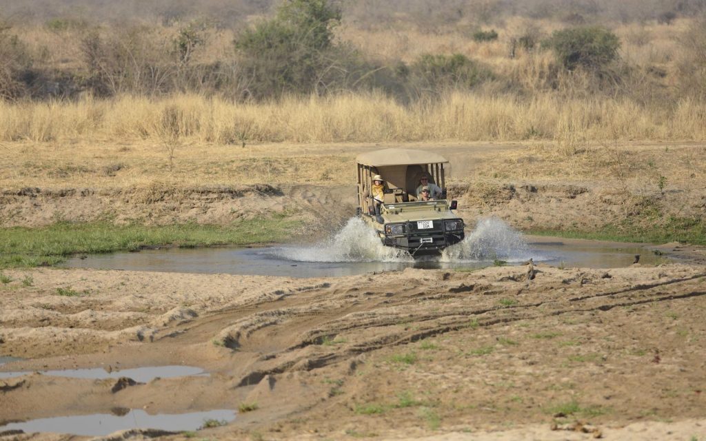 Safari vehicle crosses the Ruaha River